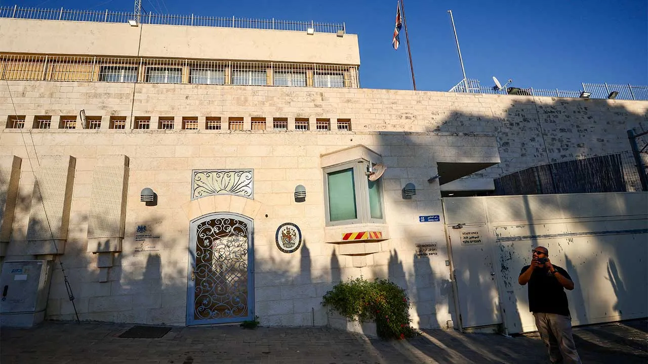 A person stands outside the British Consulate, on the day Israeli Foreign Minister Gideon Saar said he would close it in response to trade sanctions imposed by British Prime Minister Andy Burnham against Israeli settlements in the occupied West Bank, in Jerusalem, September 8, 2026. REUTERS/Jamal Awad