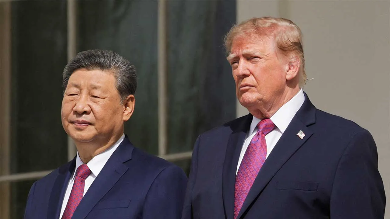 US President Donald Trump and Chinese President Xi Jinping watch a military demonstration from a balcony of the White House in Washington, D.C., US, September 24, 2026. REUTERS/Jonathan Ernst