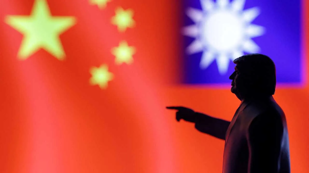 FILE PHOTO: A 3D-printed miniature model depicting U.S. President Donald Trump, Chinese flag and fragment of Taiwanese flag in this illustration taken, April 17, 2025. REUTERS/Dado Ruvic/Illustration/File Photo