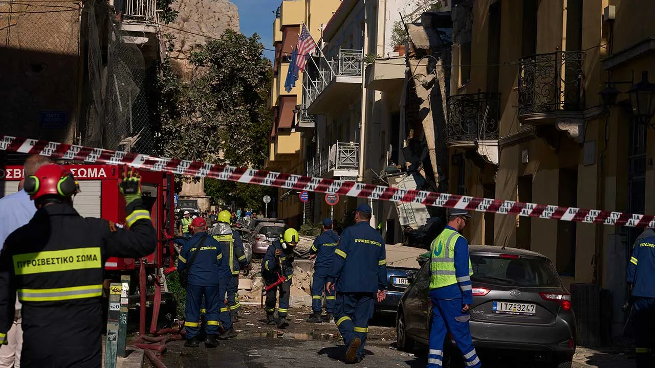 Firefighters work at the scene following a powerful blast that caused a building to collapse and injured at least two people in Athens' Plaka district, Friday, Sept. 25, 2026. (AP Photo/Petros Giannakouris)