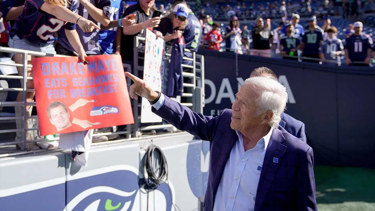 New England Patriots owner Robert Kraft looks to fans as he arrives before an NFL football game against the Seattle Seahawks, Wednesday, Sept. 9, 2026, in Seattle. (AP Photo/Stephen Brashear)
