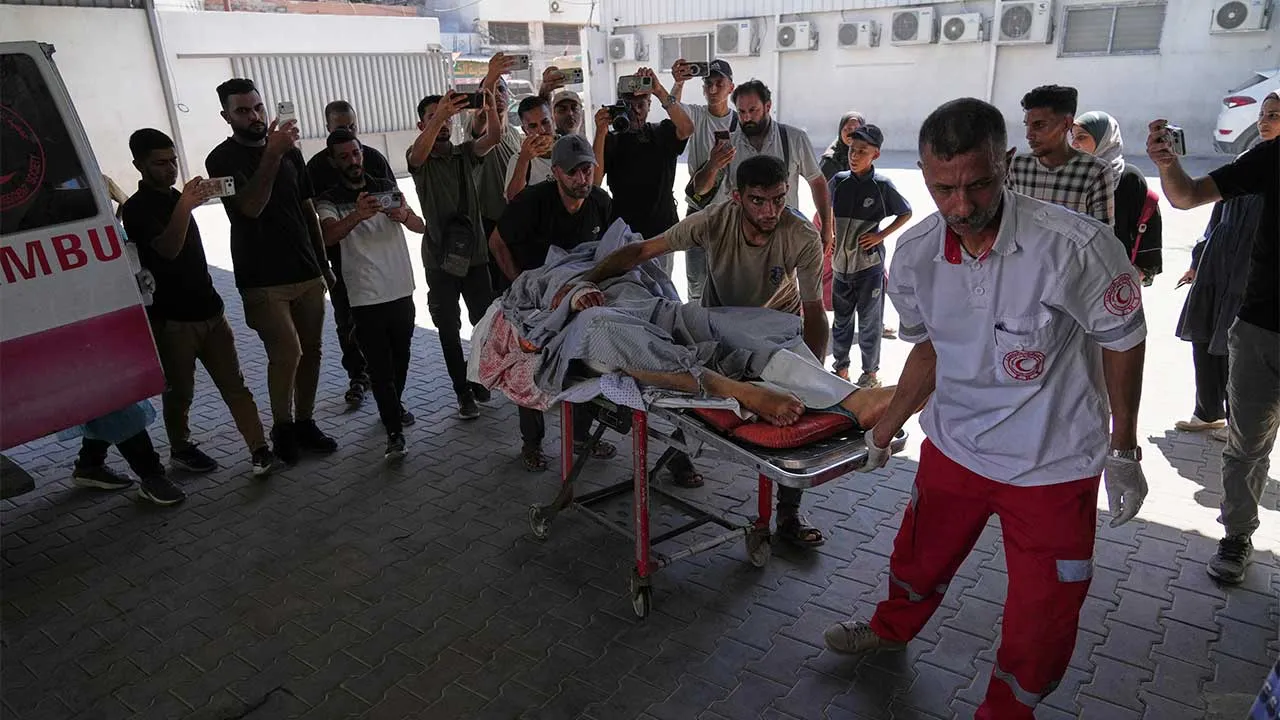 An injured Palestinian man is brought to Shifa Hospital after being wounded in an Israeli army airstrike in Gaza City, Monday, Sept. 14, 2026. (AP Photo/Jehad Alshrafi)