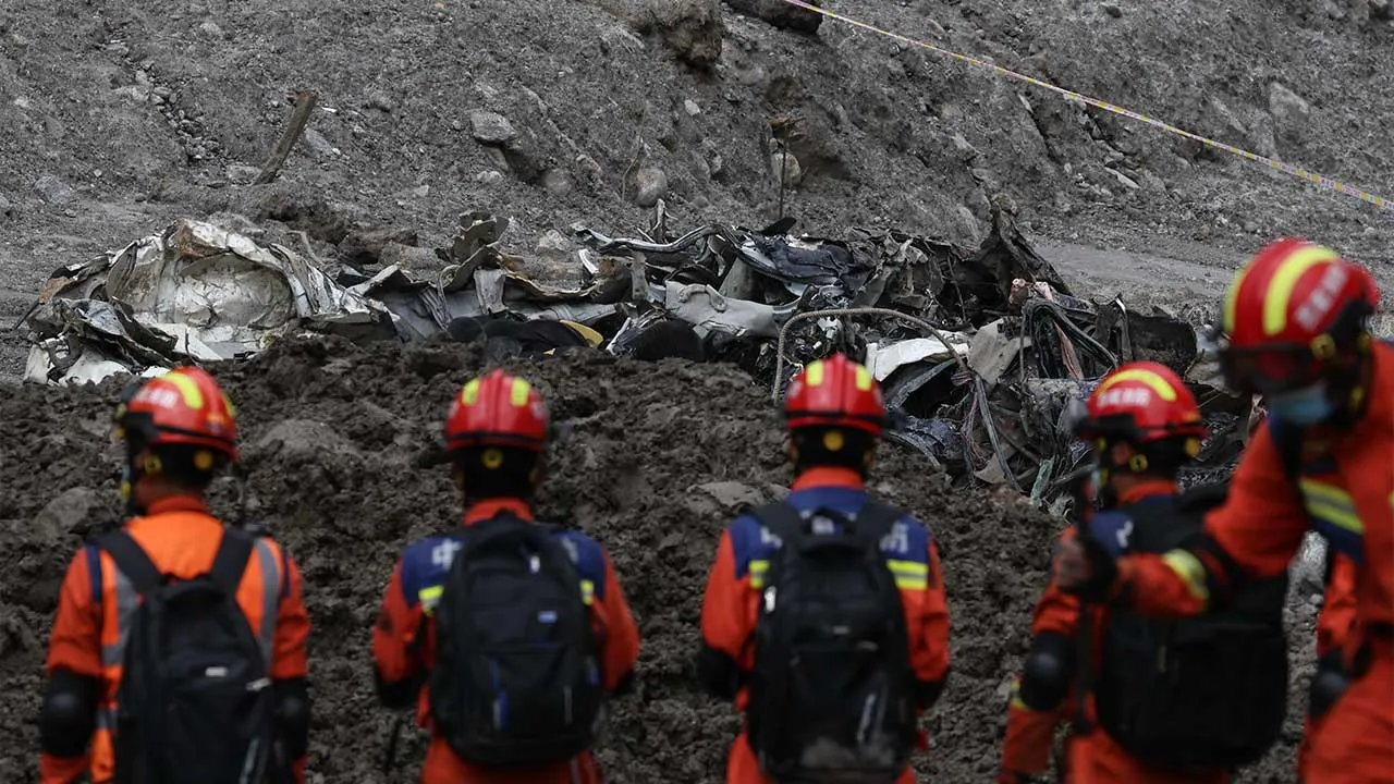 Rescue workers conduct search and rescue operations near damaged vehicles at the core disaster-hit area at Gyirong Port following the August 26 mudslide, during an organized media tour in Shigatse, Tibet Autonomous Region, China, Sunday, Sept. 6, 2026. (Tingshu Wang/Pool photo via AP)