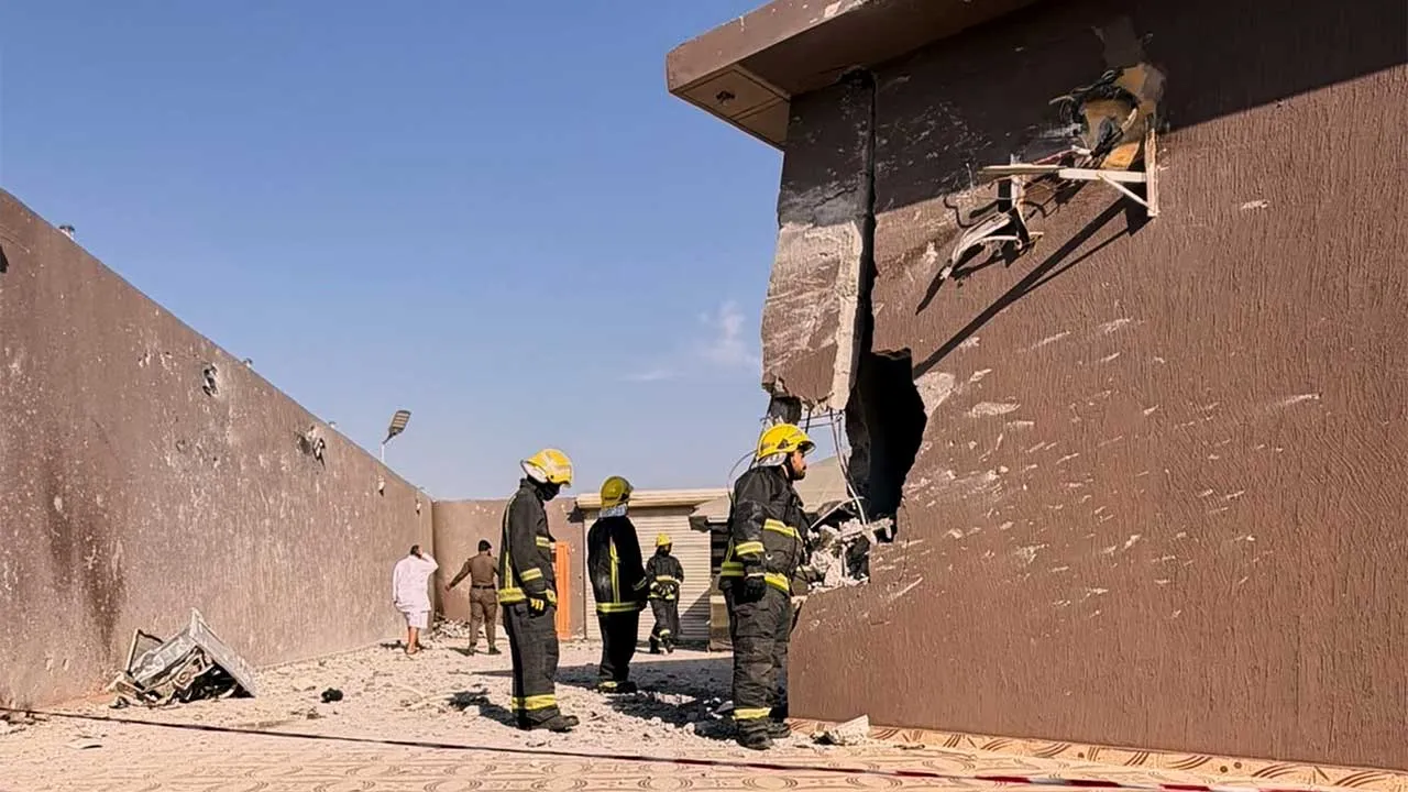This photo provided by the Saudi Press Agency shows firefighters inspecting damage to a building caused by falling debris from a drone that Saudi authorities said was launched by Yemen's Houthi rebels and intercepted over Taif province, western Saudi Arabia, Thursday, Sept. 17, 2026. (Saudi Press Agency via AP)