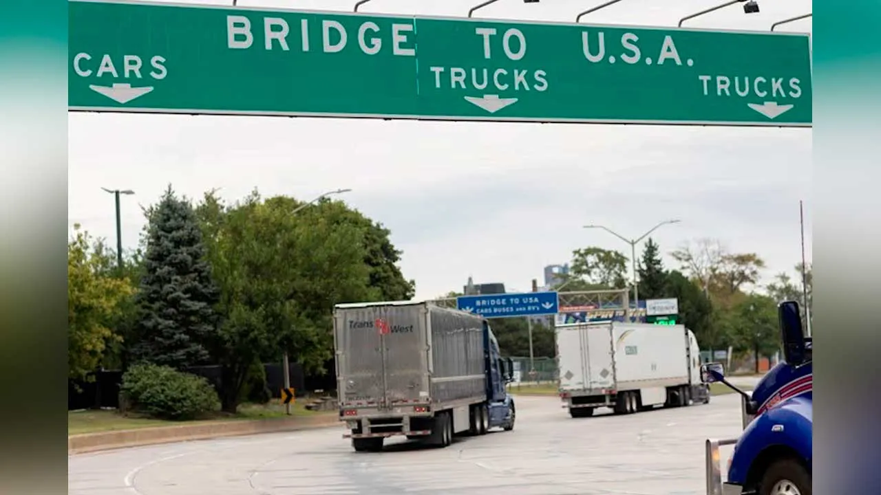 Transport trucks cross the Ambassador Bridge into the United States of America in Windsor, Ontario, Canada, on Aug 22, 2026. (Photo: Dax Melmer/The Canadian Press via AP)