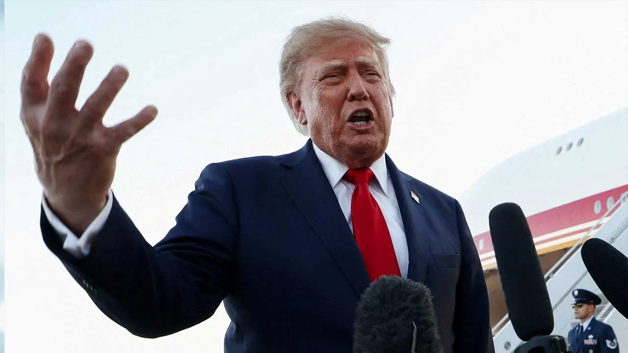 FILE PHOTO: U.S. President Donald Trump speaks to members of the press as he arrives at Charlotte Douglas International Airport, while he travels to attend a campaign rally supporting Republican U.S. Senate candidate Michael Whatley, in Charlotte, North Carolina, U.S., September 16, 2026. REUTERS/Kevin Lamarque/File Photo