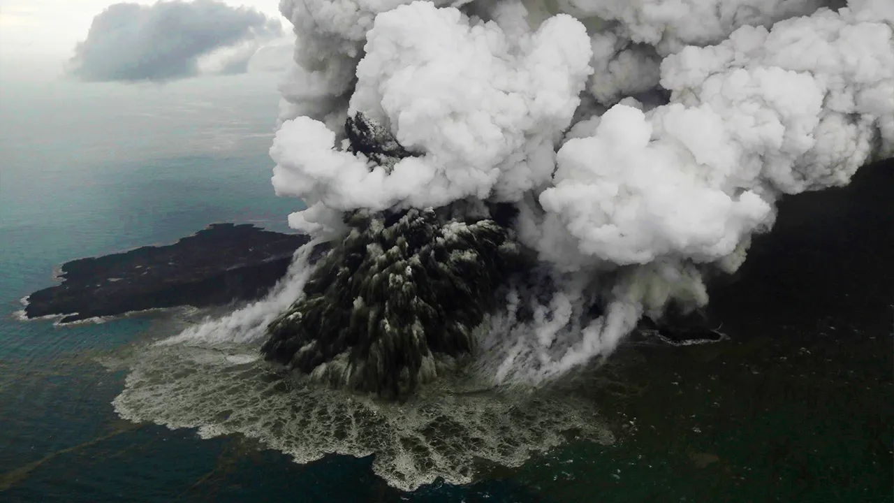 FILE - Plumes rise from Mount Anak Krakatau as it erupts in the Java Strait, Indonesia on Sunday, Dec. 23, 2018. (Nurul Hidayat/Bisnis Indonesia via AP)
