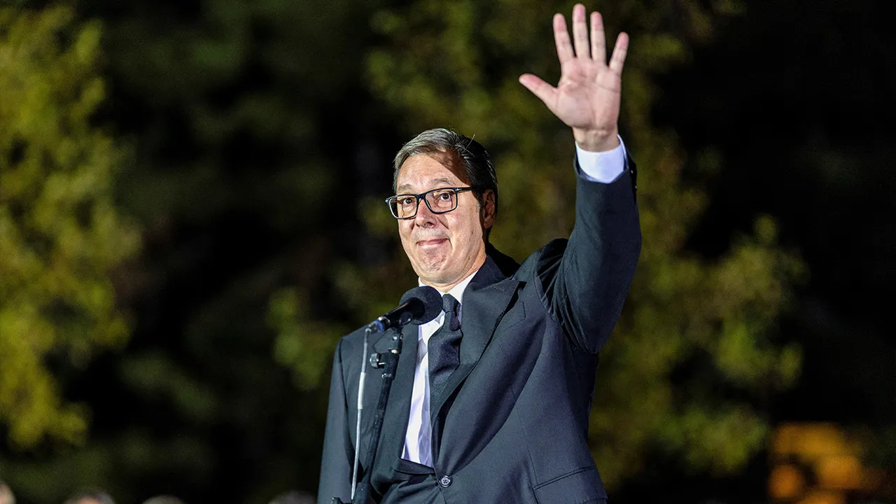 Serbian President Aleksandar Vucic waves to citizens outside the Presidency of Serbia moments before formally submitting his resignation, ending his second and final five-year term in office, in Belgrade, Serbia, September 27, 2026. REUTERS