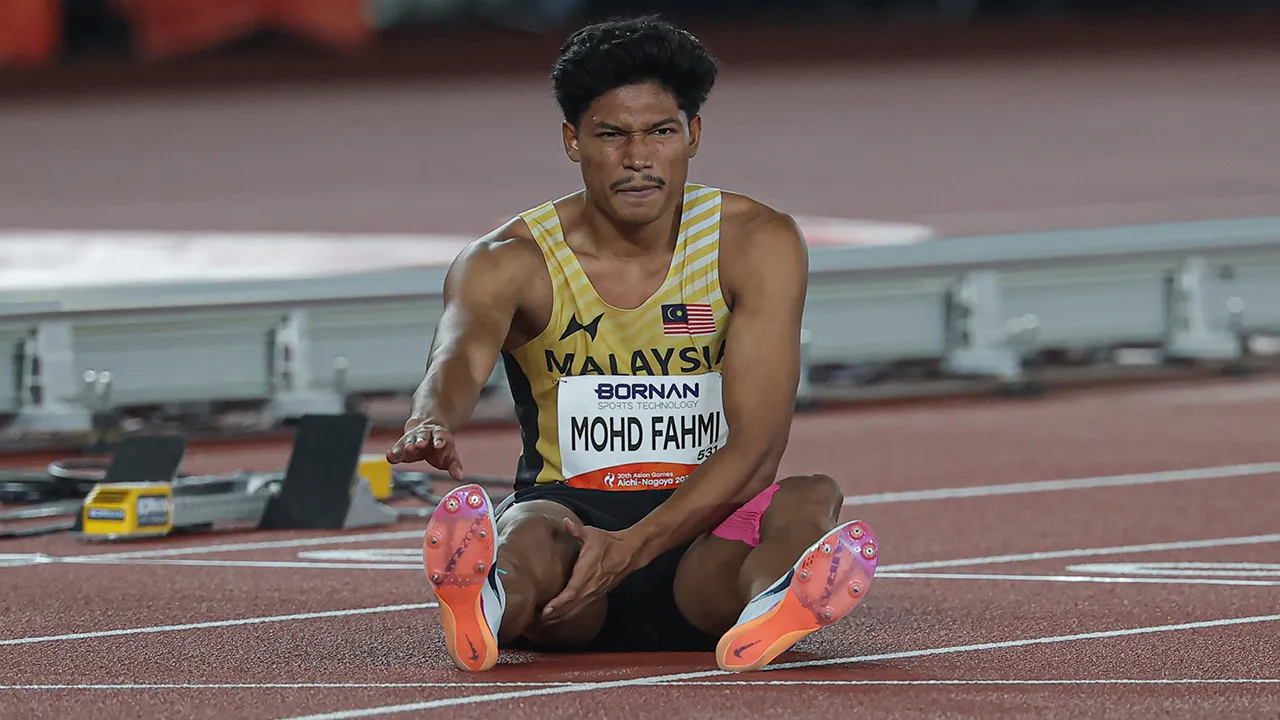 NAGOYA , 25 Sept - Pelari pecut negara Muhammad Azeem Mohd Fahmi mengalami kecederaan ketika melakukan larian pada final acara 100 meter lelaki pada Sukan Asia Aichi-Nagoya 2026 di Nagoya City Mizuho Park Athletic Stadium hari ini. - fotoBERNAMA (2026) HAK CIPTA TERPELIHARA