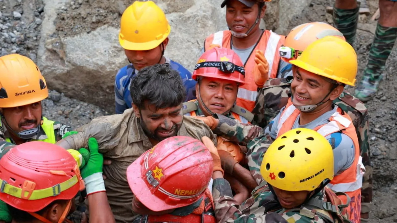 Survivor Sanjay Sah is carried by members of a search and rescue team after they rescued alive two people who had been trapped inside a tunnel at the Upper Trishuli-3A Hydropower Project following devastating floods and mudslides that struck the Bhotekoshi River in Rasuwa, Nepal, September 4, 2026. Nepal Army/Handout via REUTERS.