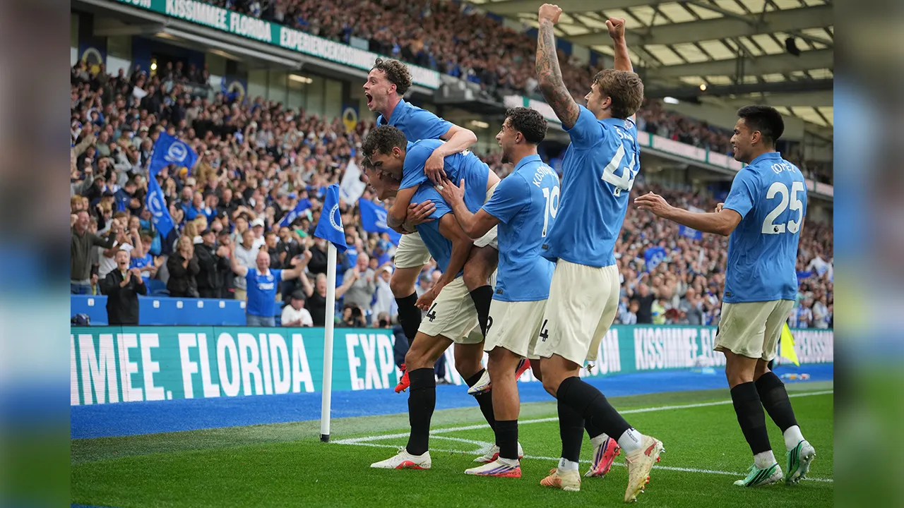 Brighton players celebrate after third goal during the English Premier League soccer match between Brighton & Hove Albion and Arsenal in Brighton, England, Saturday, Sept. 19, 2026. (AP Photo/Kin Cheung)