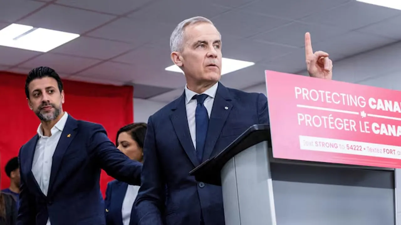 Canada’s Prime Minister Mark Carney gestures next to Maninder Sidhu, a parliamentary candidate from Brampton East, of Canada's Liberal Party, during an election campaign tour, in Brampton, Ontario, Canada April 10, 2025. REUTERS/Carlos Osorio/File Photo