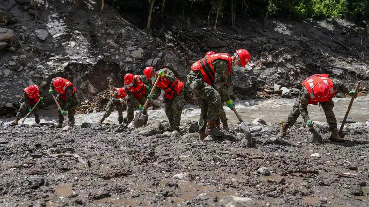 In this photo released by Xinhua News Agency, rescuers from the People's Armed Police Force search for victims at the mudslide-hit area near Gyirong Port in Gyirong County, in Xigaze, southwest China's Tibet Autonomous Region on Friday, Aug. 28, 2026. (Liu Shuang/Xinhua via AP)