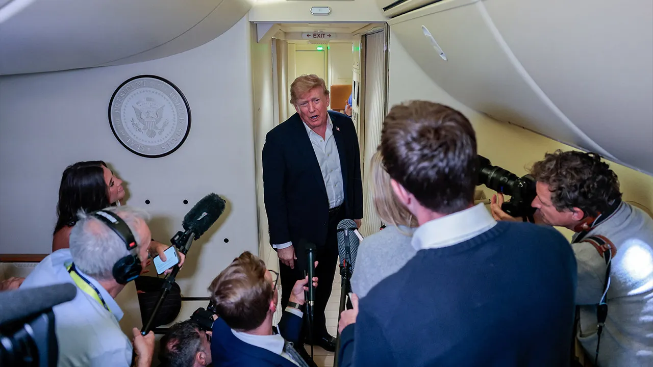 U.S. President Donald Trump speaks to members of the media aboard Air Force One, en route to Joint Base Andrews, Maryland, U.S., following a two-day visit to Ireland, September 13, 2026. REUTERS/Kylie Cooper