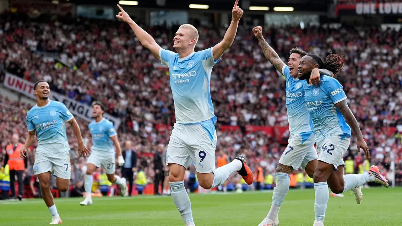 Manchester City's Erling Haaland celebrates after scoring his sides first goal during the English Premier League soccer match against Manchester United in Manchester, England, Sunday Sept. 13, 2026. (Peter Byrne/PA via AP)
