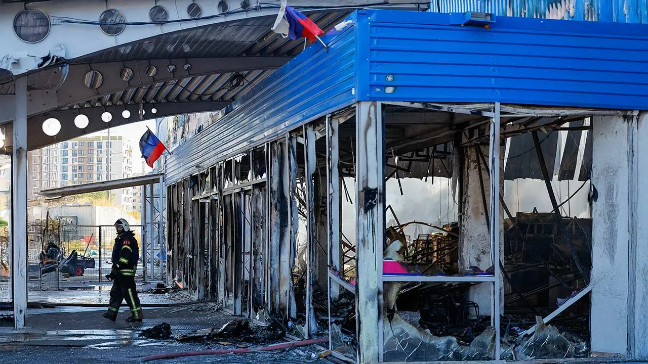 A firefighter walks out of the burnt-out shopping mall Galaktika (Galaxy) following an overnight attack, what Russian-installed authorities called a Ukrainian drone strike, in the course of the Russia-Ukraine conflict in Mariupol in the Donetsk region, a Russian-controlled area of Ukraine, September 7, 2026. REUTERS/Alexander Ermochenko