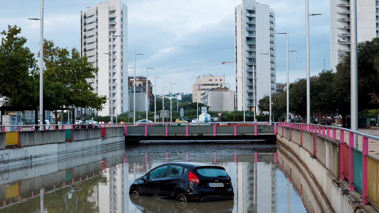A car partially submerged at the entrance of a flooded underpass after heavy rain in Torrent, near Valencia, Spain, September 17, 2026. REUTERS/