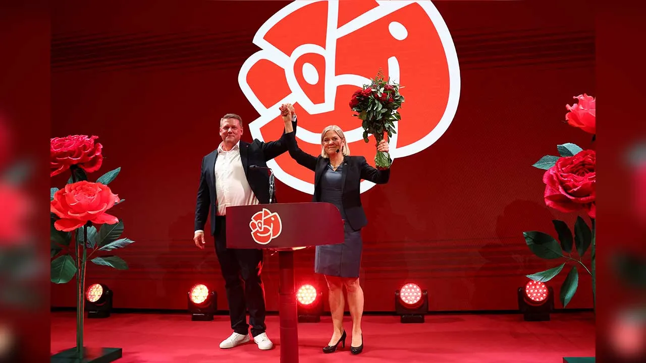 Leader of the opposition and the Swedish Social Democratic Party Magdalena Andersson and Party Secretary Tobias Baudin join hands as the general election's voting results are released in Stockholm, Sweden, September 14, 2026. REUTERS/Denis Balibouse