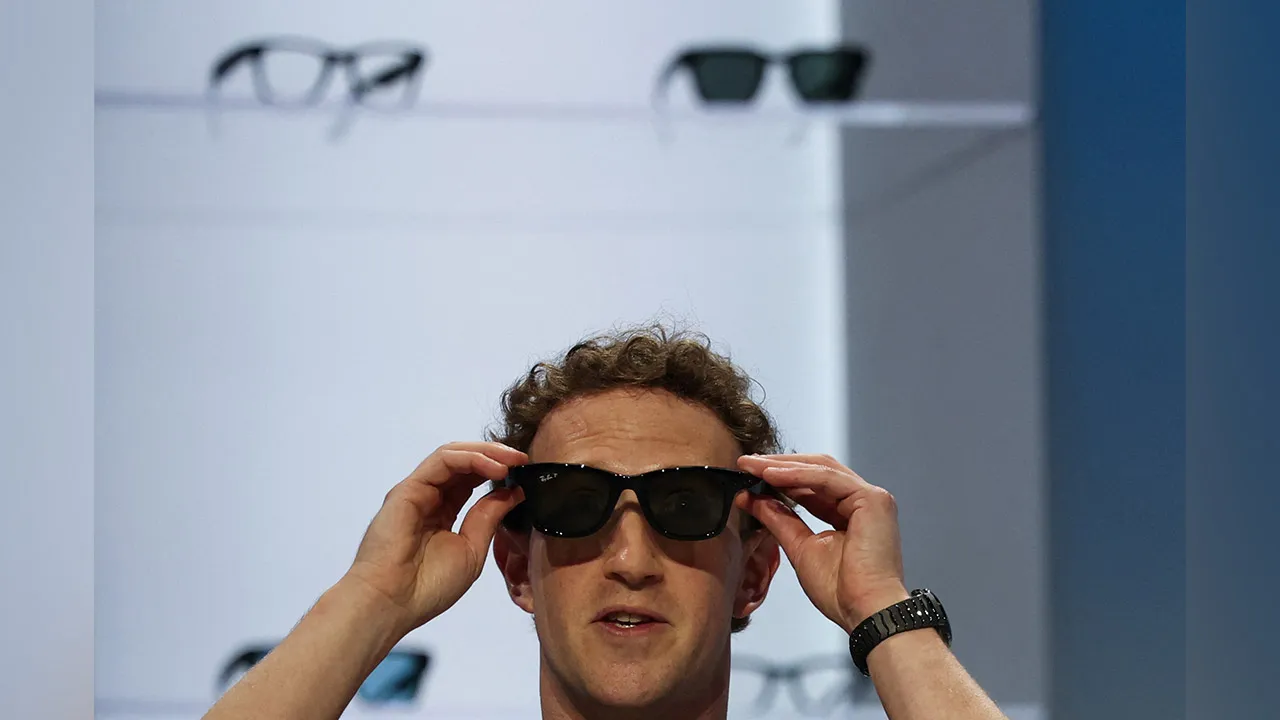 Meta CEO Mark Zuckerberg tries on Meta smart glasses during the Meta Connect event at the company's headquarters in Menlo Park, California, U.S., September 23, 2026. REUTERS/Carlos Barria