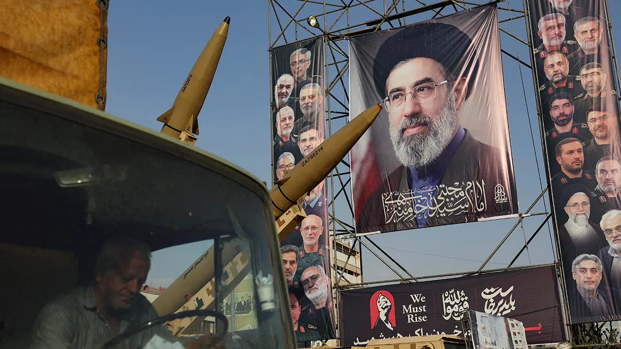 Iranian missiles are displayed next to a banner with a picture of Iran's Supreme Leader, Mojtaba Khamenei, on a street in Tehran, Iran, September 27, 2026. Majid Asgaripour/WANA (West Asia News Agency) via REUTERS