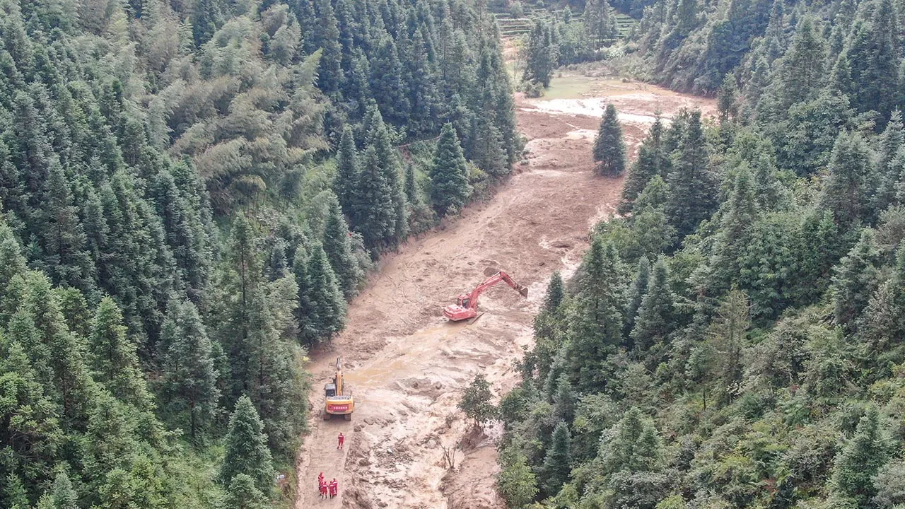 A drone view shows construction machinery clearing a road to the mudslide-hit Mingkeng village after heavy rainfall associated with Typhoon Saudel, in Suichuan county, Jian, Jiangxi province, China September 6, 2026. cnsphoto via REUTERS