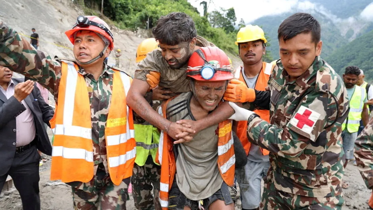 Sanjay Sah is carried by members of a search and rescue team after being one of two people rescued alive from a tunnel at the Trishuli-3A Hydropower Project, where two people had been trapped following devastating floods and mudslides that struck the Bhotekoshi River in Rasuwa, Nepal, Sep 4, 2026. (Photo: Nepal Army/Handout via REUTERS)