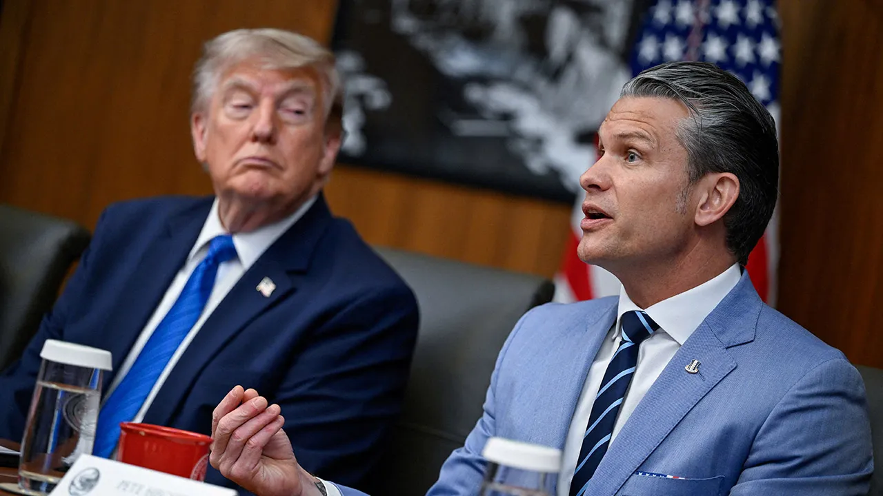U.S. President Donald Trump listens as Secretary of Defense Pete Hegseth speaks during a cabinet meeting at Camp David in Thurmont, Maryland, U.S., July 31, 2026. REUTERS/Daniel Heuer
