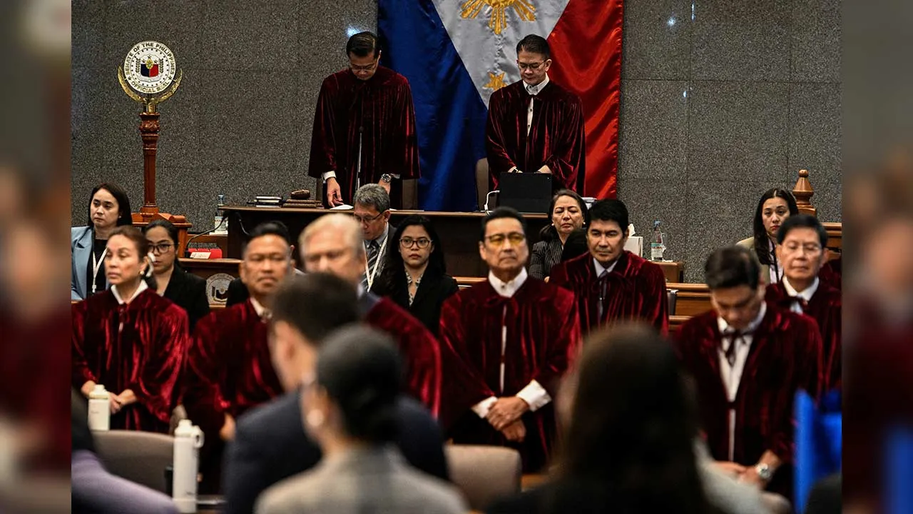 FILE PHOTO: Philippine Senators, acting judges of the impeachment court, pray at the impeachment trial of Philippine Vice President Sara Duterte at the Senate of the Philippines in Pasay, Metro Manila, Philippines, July 7, 2026. REUTERS/Noel Celis/Pool/File Photo