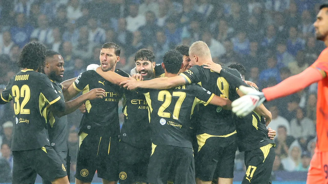 Manchester City players celebrate after Erling Haaland, right, scored the opening goal during a Champions League opening phase soccer match between FC Porto and Manchester City in Porto, Portugal, Tuesday, Sept. 8, 2026. (AP Photo/Luis Vieira)