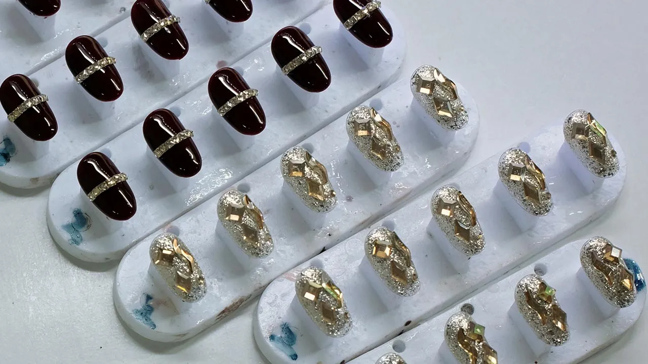 Finished press-on nails on the production line at Donghai Yizhigu Nail Art factory in Donghai county, Lianyungang, Jiangsu province, China September 17, 2026. REUTERS/Chenxi Yang