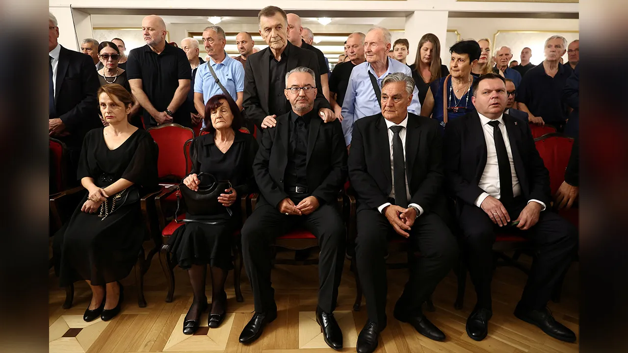 Former Bosnian Serb wartime general Ratko Mladic’s wife, Bosiljka, his son, Darko, and the President of Republika Srpska, Sinisa Karan, attend a commemoration ceremony for Mladic in Belgrade, Serbia, September 5, 2026. REUTERS/Zorana Jevtic