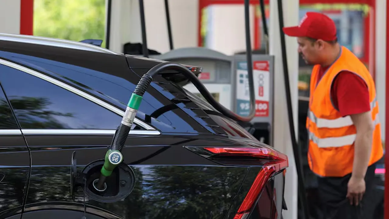 A fuel attendant works at a Lukoil petrol pump in Moscow, Russia, July 1, 2026. REUTERS/Ramil Sitdikov
