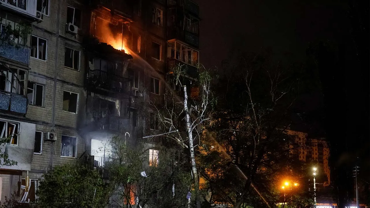 Firefighters work at the site of an apartment building hit by a Russian drone strike, amid Russia's attack on Ukraine, in Kyiv, Ukraine, September 11, 2026. REUTERS/Gleb Garanich