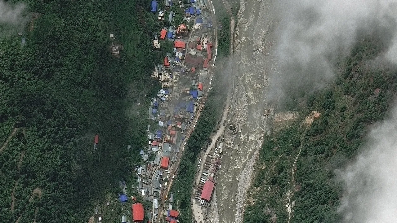 A satellite image shows buildings and roads before flash floods and a mudslide, in Timure, Nepal, July 1, 2026. Vantor/Handout via REUTERS THIS IMAGE HAS BEEN SUPPLIED BY A THIRD PARTY. NO RESALES. NO ARCHIVES. MANDATORY CREDIT. DO NOT OBSCURE LOGO.