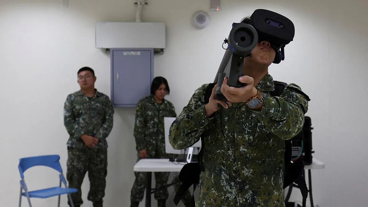 Soldiers demonstrate a Stinger missile system simulator during a media event at Tainan Air Base in Tainan, Taiwan September 22, 2026. REUTERS/Tsai Hsin-Han