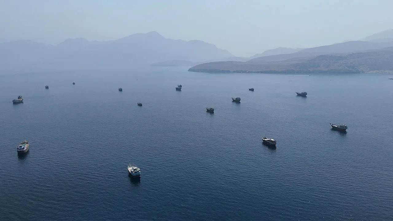 FILE PHOTO: A drone view shows vessels near the Strait of Hormuz, as seen from Musandam, Oman, August 28, 2026. REUTERS/Stringer/File Photo