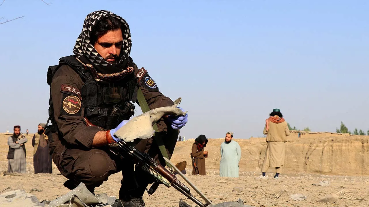 FILE PHOTO: A member of the Taliban security forces inspects metal debris at the site of a partially damaged house following what Taliban officials say was a Pakistani airstrike in Gurbuz district, Khost province, Afghanistan, September 24, 2026. REUTERS/Stringer/File Photo