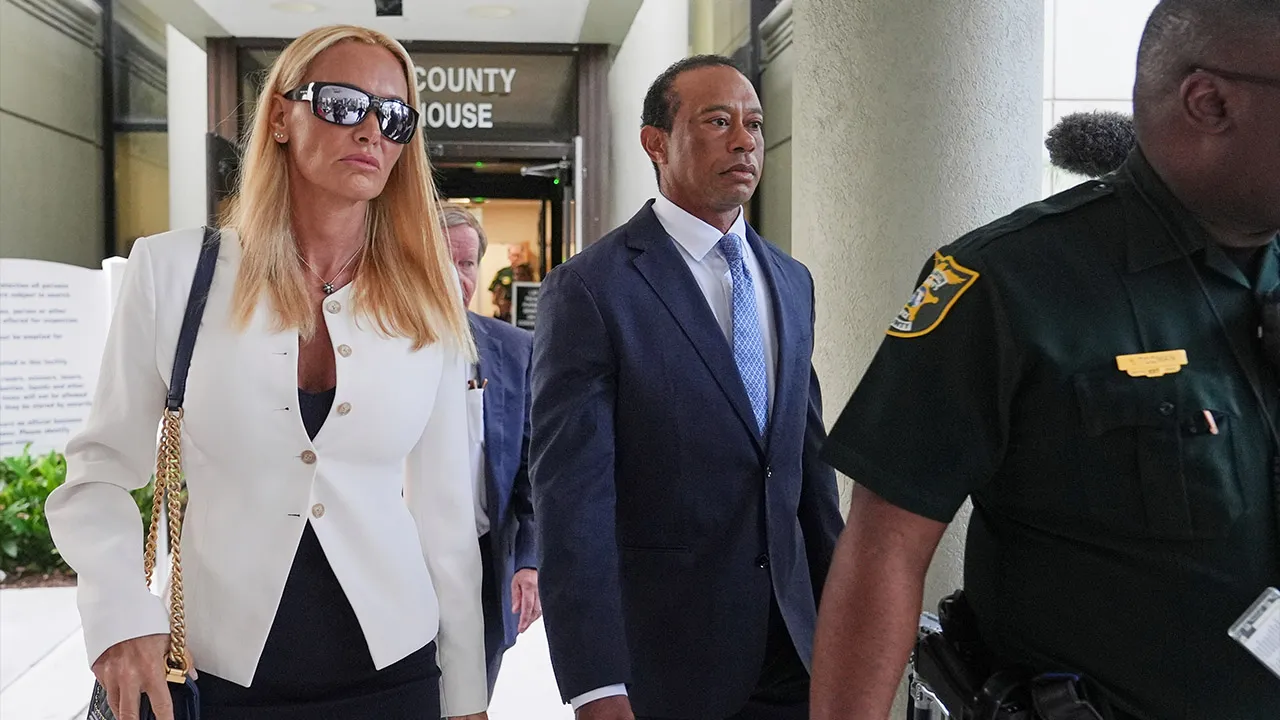 Golfer Tiger Woods, right, leaves with Vanessa Trump, left, after Woods' plea conference hearing in a DUI case stemming from a rollover crash in Florida in March, Wednesday, Sept. 2, 2026, in Stuart, Fla. (AP Photo/Lynne Sladky)