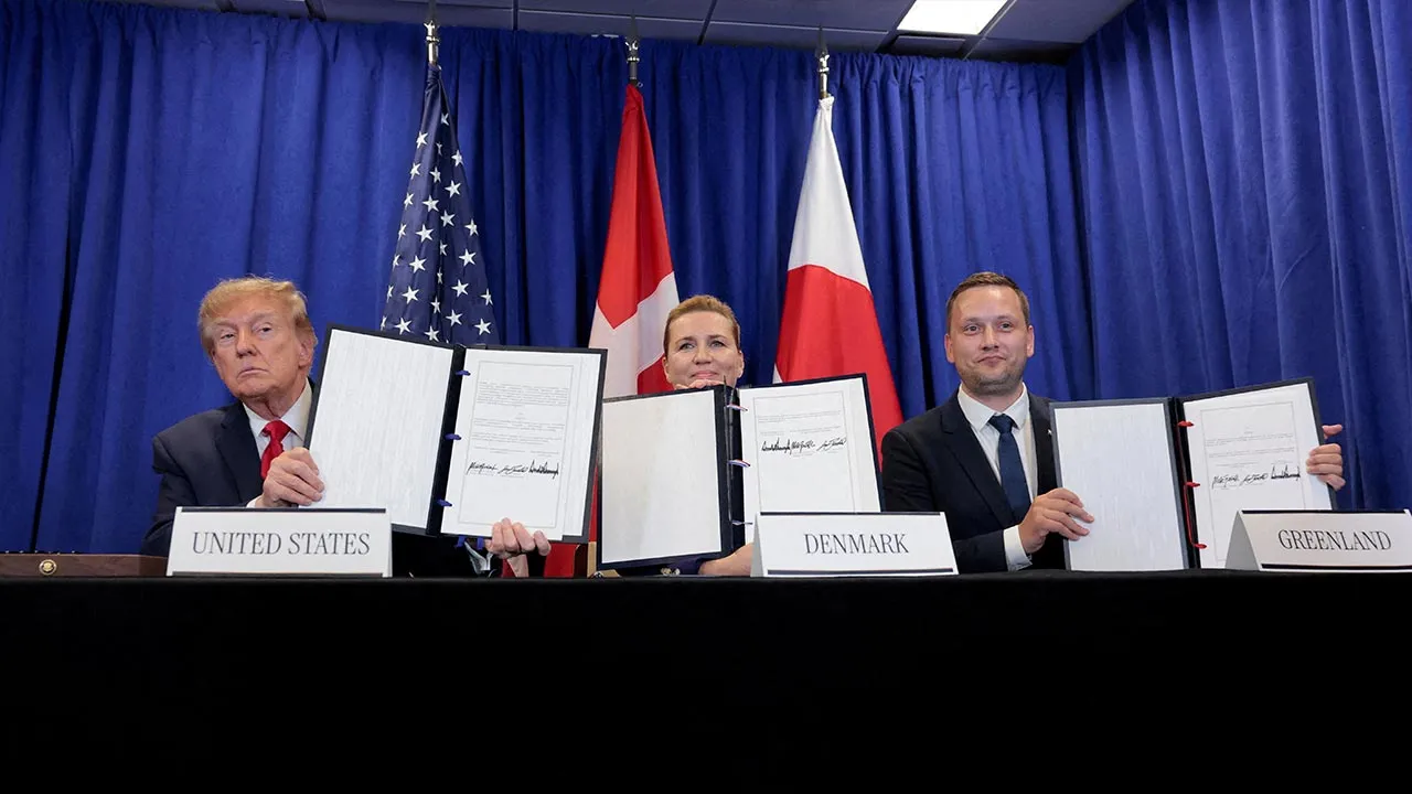 US President Donald Trump, Danish Prime Minister Mette Frederiksen and Greenland Prime Minister Jens-Frederik Nielsen show signed documents during a trilateral signing event regarding a deal on Greenland's security, during the 81st United Nations General Assembly (UNGA), in New York City, US, September 22, 2026. REUTERS/Kylie Cooper