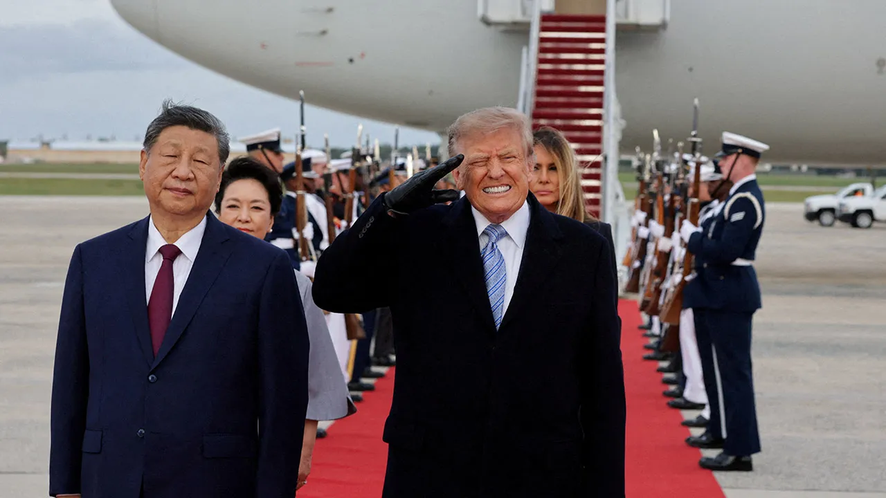 US President Donald Trump reacts to the roar of B-1 bomber flyover during the U.S. national anthem as Trump salutes next to Chinese President Xi Jinping during an arrival ceremony ahead of a state visit at Joint Base Andrews, Maryland, US, September 23, 2026. REUTERS/Jonathan Ernst