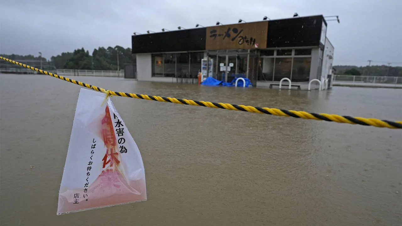 The area around a ramen restaurant is flooded by heavy rain as Typhoon Dujuan approaches, in Oamishirasato, Chiba Prefecture, Japan, September 21, 2026 in this photo taken by Kyodo. Kyodo/via REUTERS 