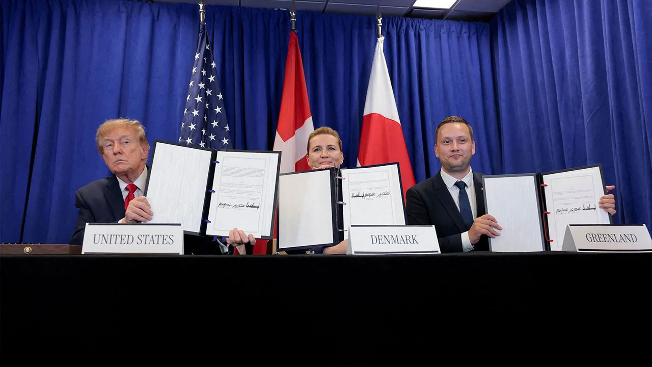 US President Donald Trump, Danish Prime Minister Mette Frederiksen and Greenland Prime Minister Jens-Frederik Nielsen show signed documents during a trilateral signing event regarding a deal on Greenland's security, during the 81st United Nations General Assembly (UNGA), in New York City, US, September 22, 2026. REUTERS/Kylie Cooper TPX IMAGES OF THE DAY