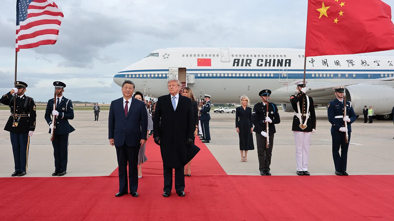 US President Donald Trump and Chinese President Xi Jinping speak as Xi arrives ahead of a state visit at Joint Base Andrews, Maryland, US, September 23, 2026. REUTERS/