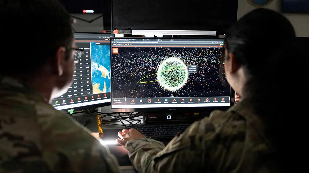 U.S. Space Force Guardians assigned to Space Delta 5 monitor computer workstations at Vandenberg Space Force Base, California, U.S., December 18, 2025. U.S. Space Forces/David Dozoretz/Handout via REUTERS 