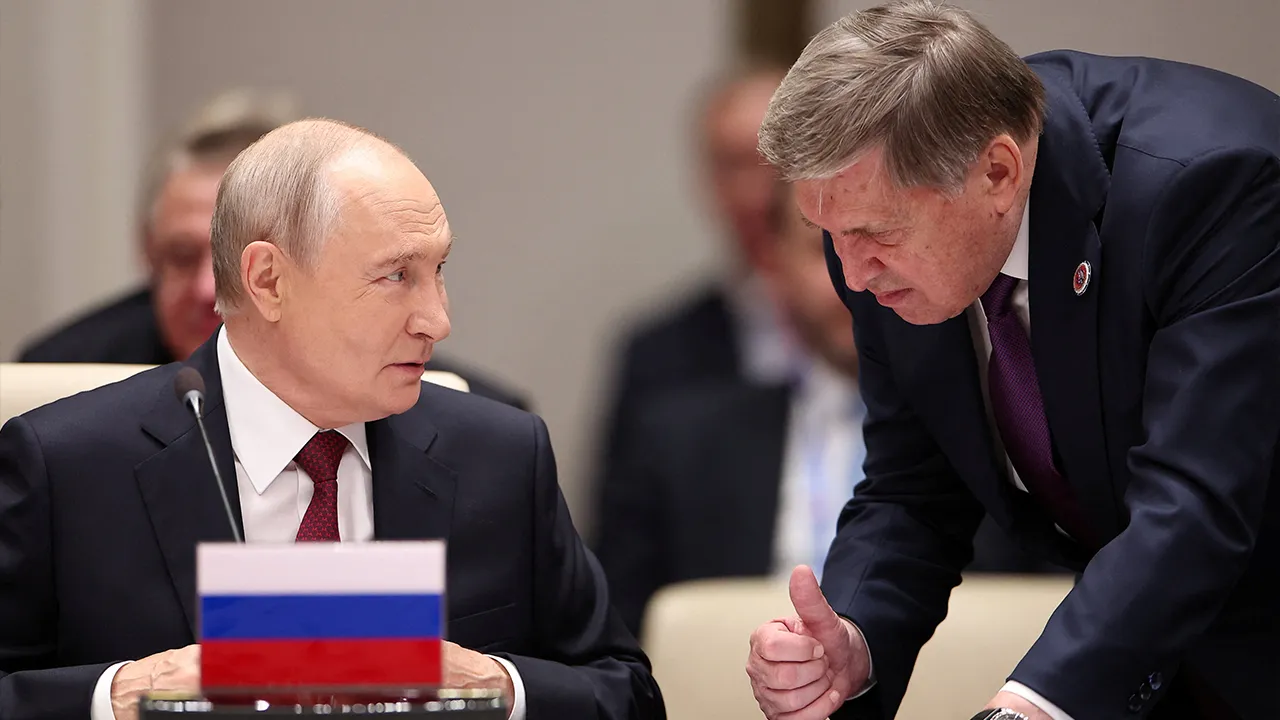 Russian President Vladimir Putin talks to his aide Yury Ushakov before a session of the Shanghai Cooperation Organisation (SCO) summit in Bishkek, Kyrgyzstan September 1, 2026. Sputnik/Petr Kovalev/Pool via REUTERS