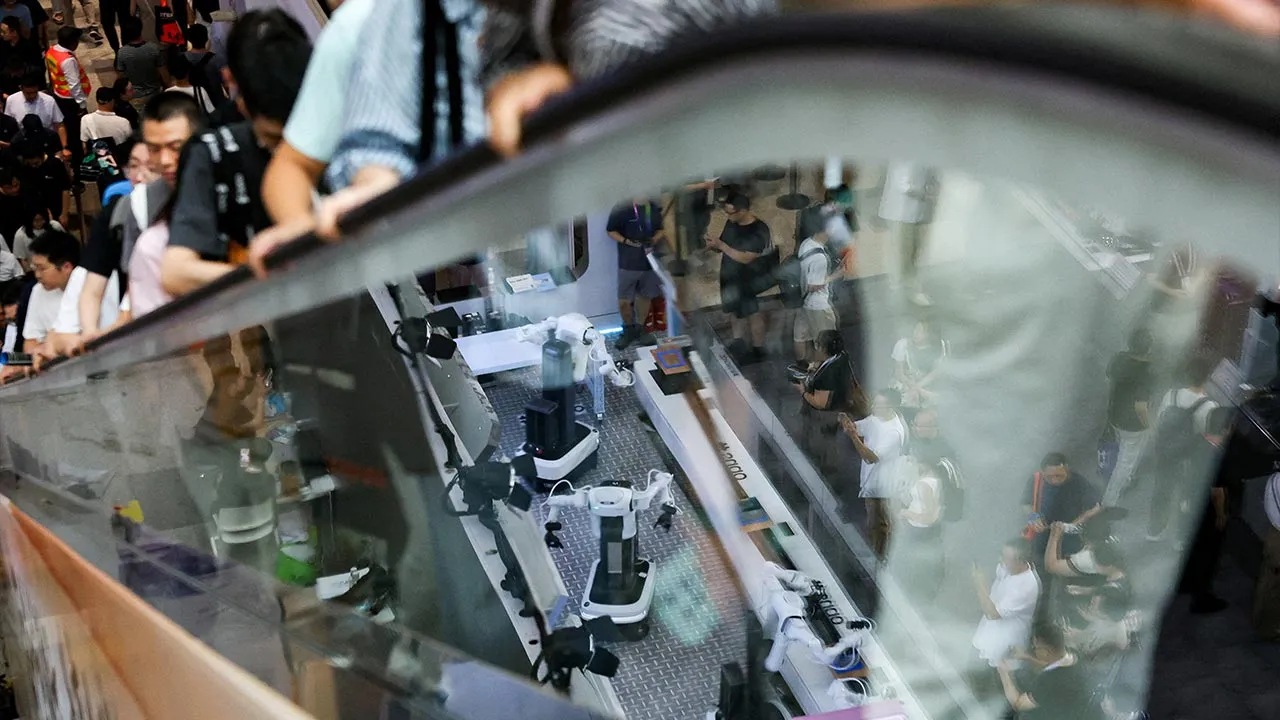 FILE PHOTO: People visit the World Artificial Intelligence Conference (WAIC) in Shanghai, China, July 18, 2026. REUTERS/Go Nakamura/File Photo