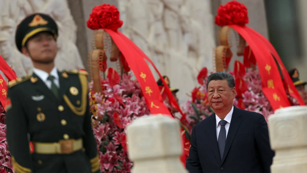 Chinese President Xi Jinping walks past floral baskets at the Monument to the People's Heroes during a ceremony to mark Martyrs' Day, a day ahead of the Chinese National Day, on Tiananmen Square in Beijing, China September 30, 2026. REUTERS/Florence Lo