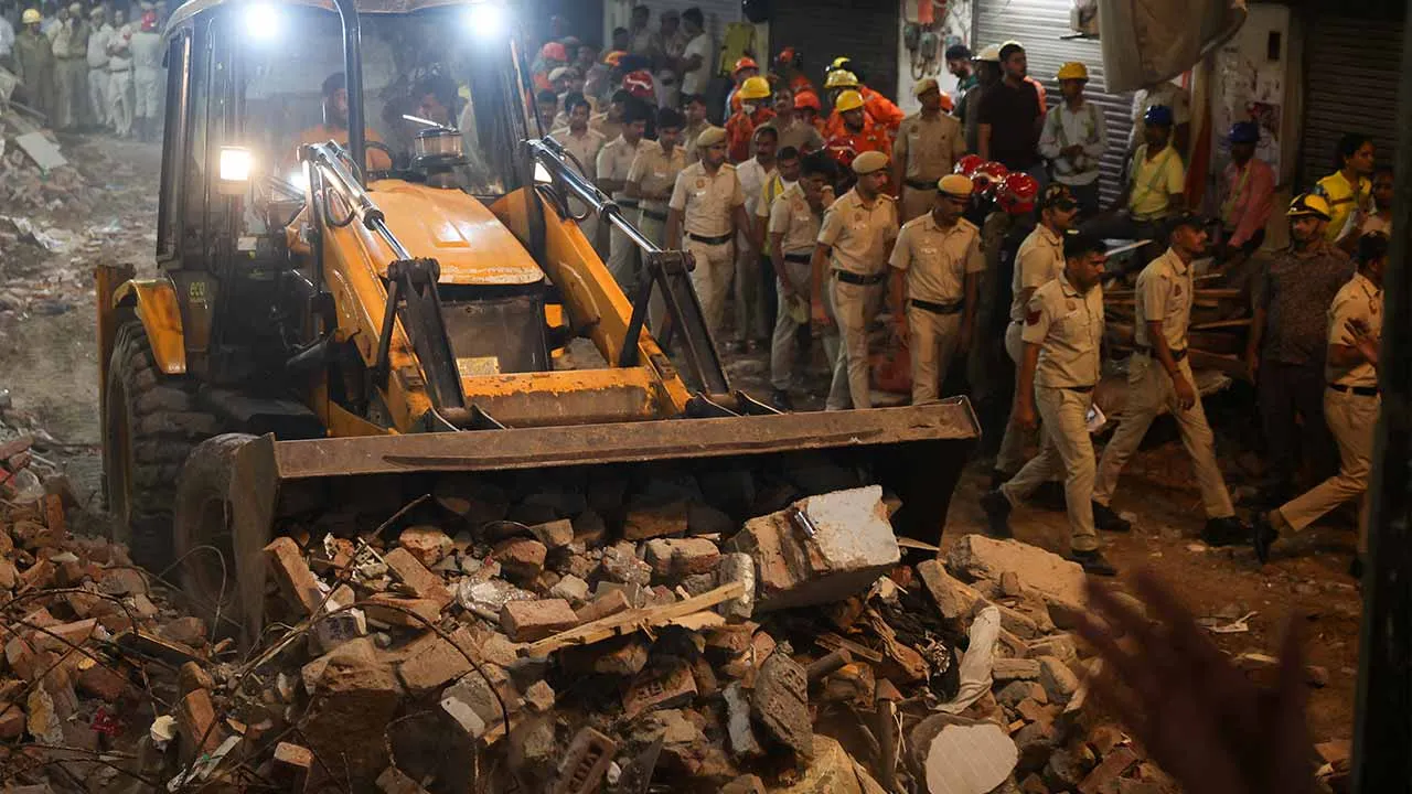 Emergency personnel work at the site and look for survivors after a building collapsed, in New Delhi, India, September 6, 2026. REUTERS/Francis Mascarenhas