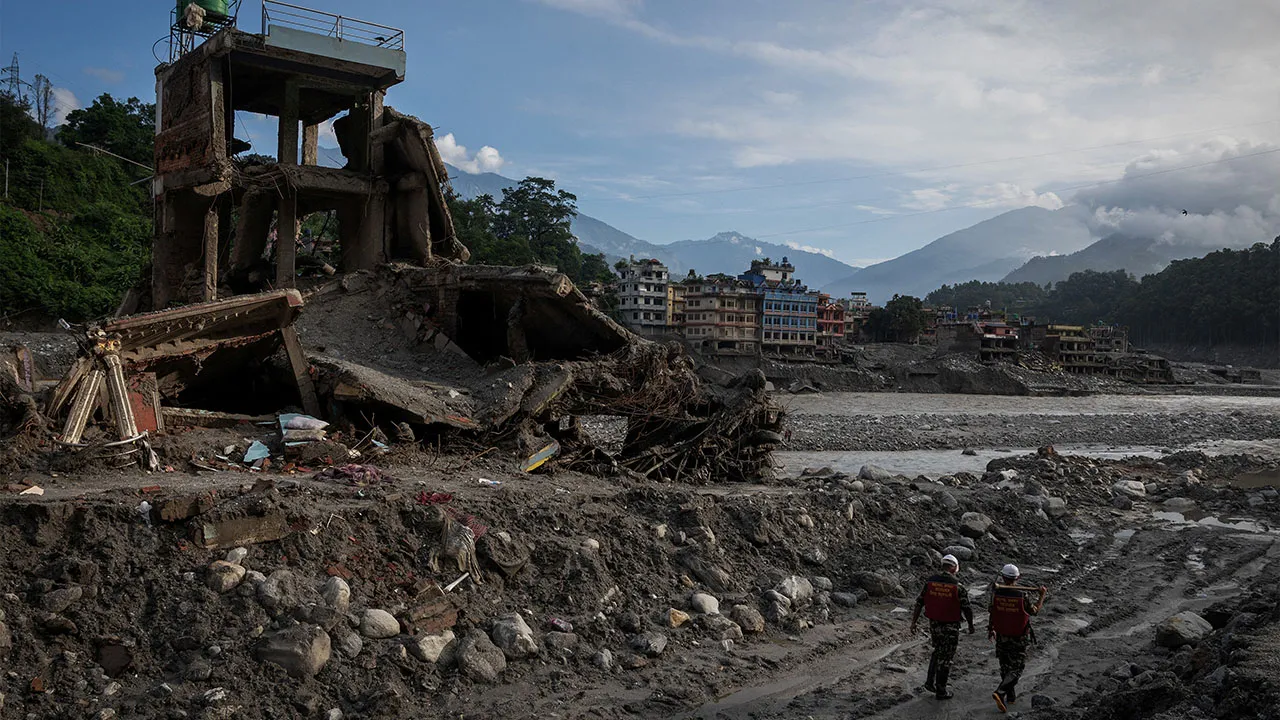 Members of the Nepal Army rescue team walk past the damaged houses, following deadly flash floods and a mudslide, in Trishuli, Nuwakot district, Nepal, September 8, 2026. REUTERS/Adnan Abidi