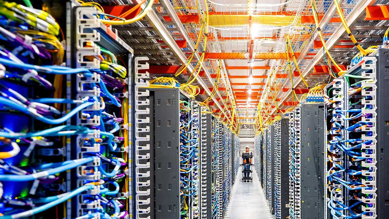 FILE PHOTO: A technician works at an Amazon Web Services AI data center in New Carlisle, Indiana, U.S., October 2, 2025. REUTERS/Noah Berger for AWS/File Photo